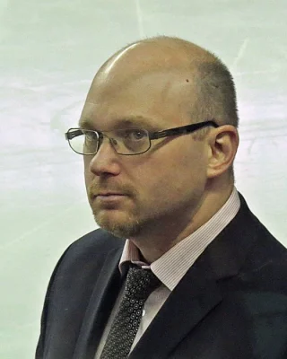 André Tourigny — логотип